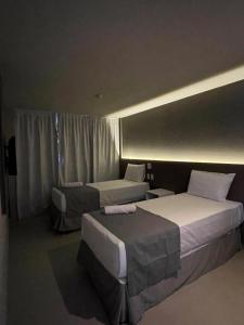 Postel nebo postele na pokoji v ubytování Saint Patrick Grand Hotel