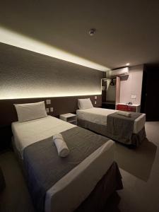 Postel nebo postele na pokoji v ubytování Saint Patrick Grand Hotel
