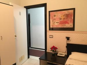 Postel nebo postele na pokoji v ubytování Hotel Letizia