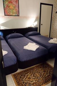 Cama ou camas em um quarto em Hotel Letizia