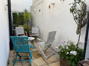 three chairs and a table on a patio at Da Giuseppe London in London