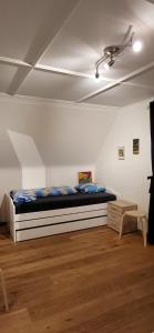 Katil atau katil-katil dalam bilik di Ferienhaus Barbey