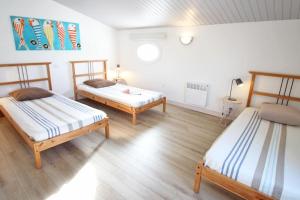Postel nebo postele na pokoji v ubytování Le Clos des Flots - Le Phare