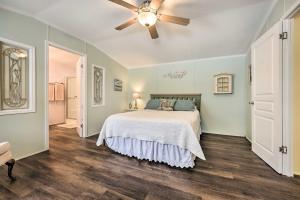 een slaapkamer met een bed en een plafondventilator bij Charming South Haven Home - Great Location! in South Haven