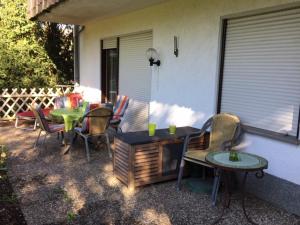 a patio with a table and chairs and a table and a table and chairs at Emotion zentrumsnah für bis zu 6 Personen in Winterberg