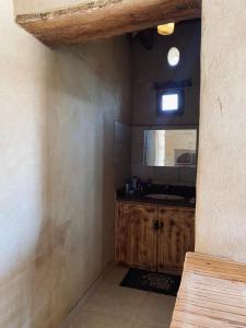 a kitchen with a sink and a counter in a room at Siwa Desert Home in ‘Izbat Ţanāţī