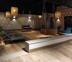 a lobby with chairs and a table and lights at Kastel Petrópolis in Petrópolis +33 photos