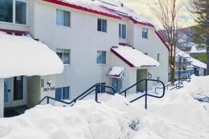 a pile of snow in front of a building at Mountainside 20 in Warren