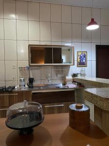 Una cocina o kitchenette en Instituto e Pousada Asa