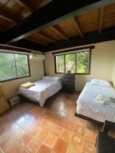 Postel nebo postele na pokoji v ubytování La Cabin de Guido