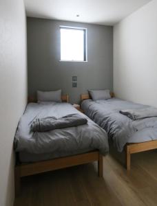 Postel nebo postele na pokoji v ubytování Niseko Bisha 美舎 Villas
