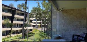 a view of an apartment building from a window at Lindo y Equipado Departamento in Pucón