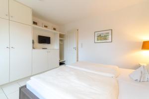 Ένα ή περισσότερα κρεβάτια σε δωμάτιο στο Nordland Appartements Wohnung Falster +19 φωτογραφίες
