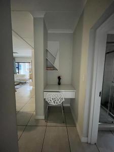 a room with a desk and a chair in it at The Blyde Riverwalk Estate, Crystal Lagoon, Pretoria east in Pretoria