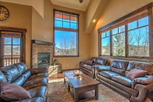 a living room with leather couches and a fireplace at 5-Star Finishings Townhome, Minutes from World Class Ski Resorts, Hot Tub home in Silverthorne