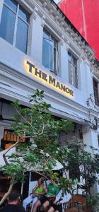 a sign that reads the manor on the side of a building at The Manor by Mingle in Kuala Lumpur