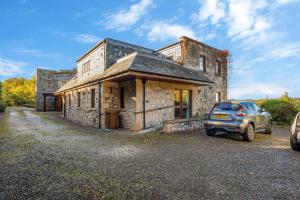 a car parked in front of a stone building at The Keep at Craigiehall in Edinburgh