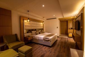 Letto o letti in una camera di The Pristine Hotel