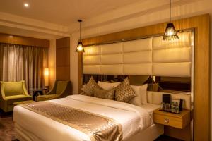 Letto o letti in una camera di The Pristine Hotel