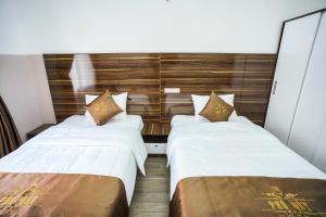 Postel nebo postele na pokoji v ubytování PHÚ QUÝ HOTEL near ĐÔNG KINH MARKET