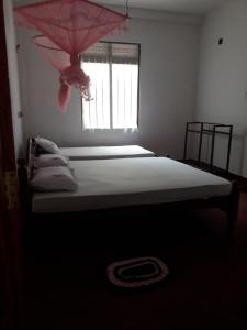 Postel nebo postele na pokoji v ubytování Margosa Guesthouse