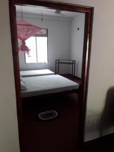 Postel nebo postele na pokoji v ubytování Margosa Guesthouse