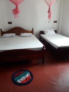 Postel nebo postele na pokoji v ubytování Margosa Guesthouse