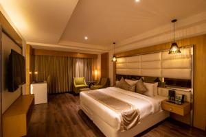 Letto o letti in una camera di The Pristine Hotel