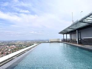 a swimming pool on the roof of a building at Ins Suite @ The Quartz Residence-Infinity Pool in Melaka