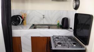 Kuchyň nebo kuchyňský kout v ubytování Essie towers accomodation + 8 fotografií