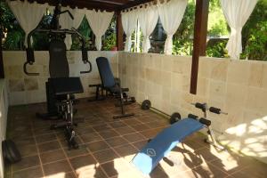 a gym with exercise equipment in a house at Villa Boreh Beach Resort and Spa in Tejakula