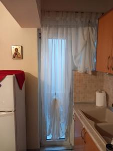 Kuchyň nebo kuchyňský kout v ubytování Poly's cozy home