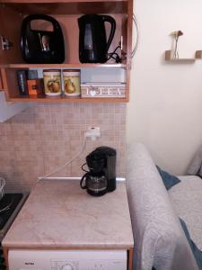 Kuchyň nebo kuchyňský kout v ubytování Poly's cozy home