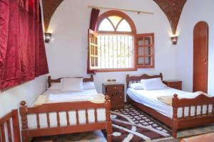 Postel nebo postele na pokoji v ubytování Luxor Villa Hatshepsut