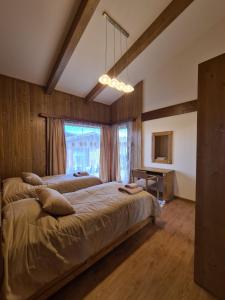 a bedroom with two beds and a window at Pirin Golf Villa Compass Property in Bansko +13 photos