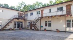 a building with a staircase on the side of it at Apartment Black der Sportschule Badura in Leipzig