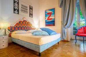 Letto o letti in una camera di Byblos Art Hotel Villa Amistà