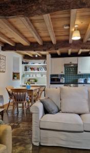 a living room with a couch and a table at Cringley Cottage in Askrigg