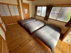 Giường trong phòng chung tại ARS Hotel Nikko Imaichi 一棟貸切