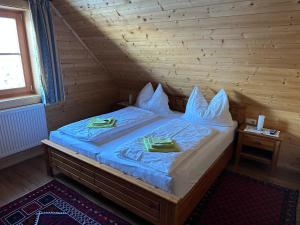 a bedroom with a bed in a wooden room at Gerstbreinhütte in Bad Sankt Leonhard im Lavanttal