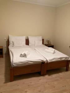 Postel nebo postele na pokoji v ubytování Wildente Vadászház