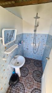 a bathroom with a sink and a shower at koh mook oyoy reggaebar bungalow in Ko Mook +57 photos