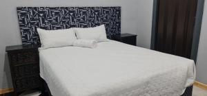 Ένα ή περισσότερα κρεβάτια σε δωμάτιο στο Black Owl Lodge +18 φωτογραφίες