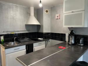 a kitchen with a sink and a counter top at ღ Joli appartement T2 40m2 ღ in Magny-le-Hongre
