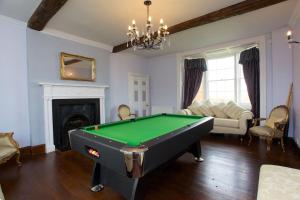 a living room with a pool table in it at Dunnimere Farm stay with Hot Tub - up to 20 in Haselour