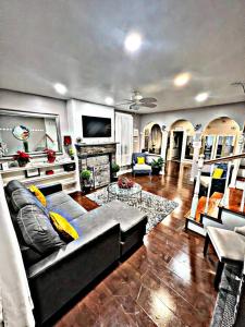 a living room with a couch and a fireplace at Delightful Empowerment Palace in Philadelphia