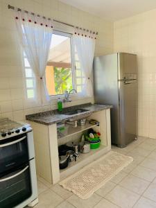 Kjøkken eller kjøkkenkrok på Aguas de São Pedro ambiente Familiar e Aconchegante