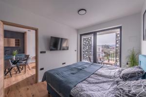 Postel nebo postele na pokoji v ubytování Apartmaji Harpf