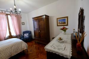 Posteľ alebo postele v izbe v ubytovaní Il Melograno - San Quirico d'Orcia