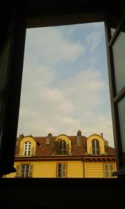 a view of a building through a window at Aprile in Turin